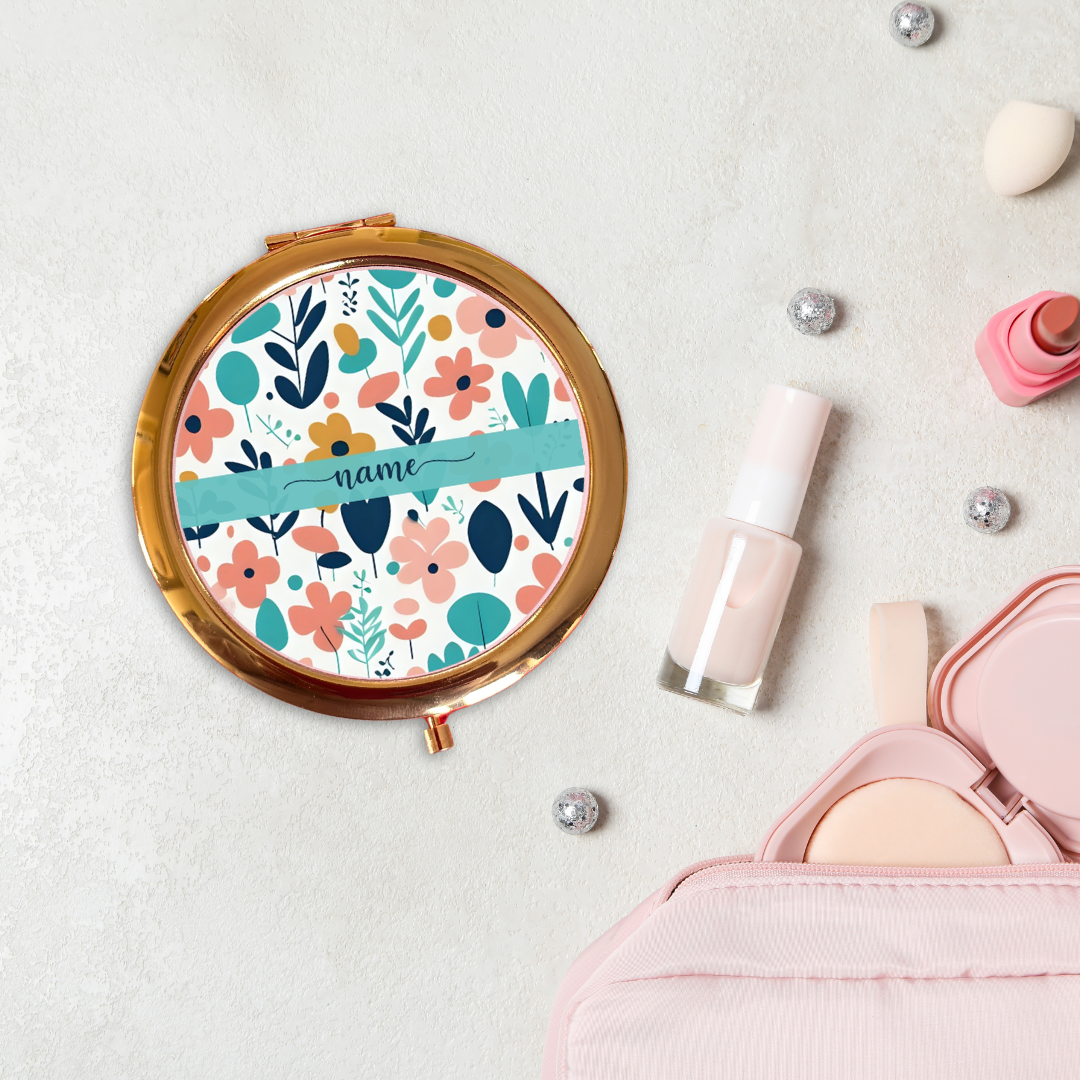 Round floral compact mirror with decorative elements on a light background