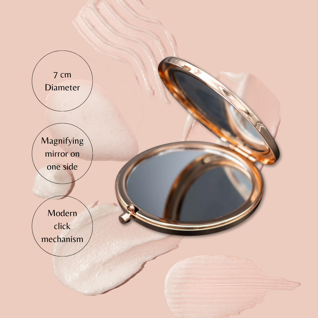 Compact mirror with magnifying feature on a soft pink background