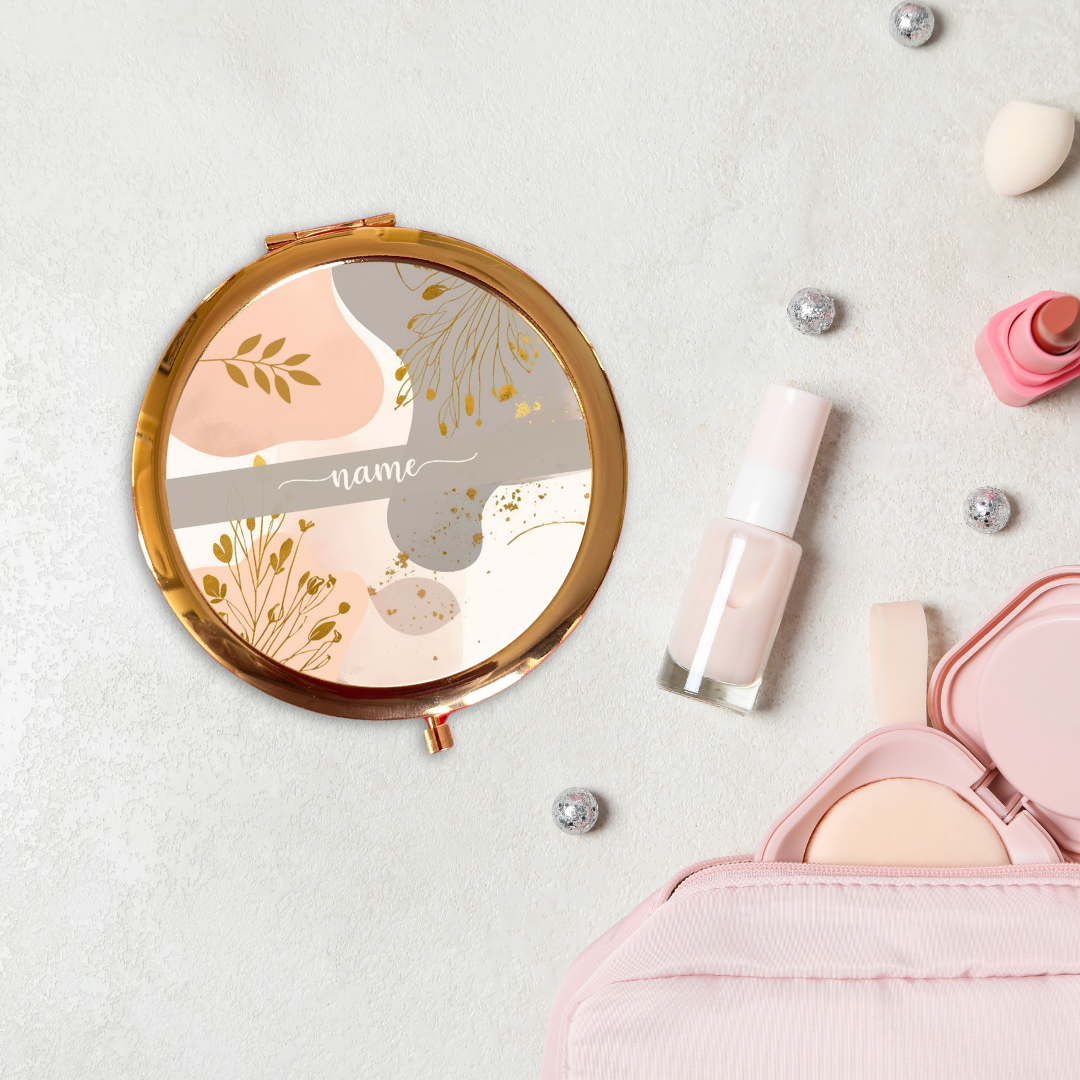 Makeup items including a compact mirror, nail polish, and a pink case on a light background
